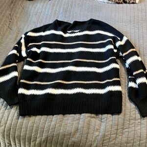 Large sweater, black gold and white. So cute.